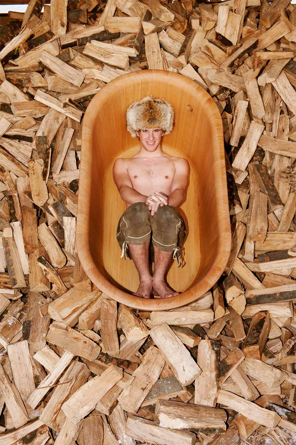 Image by Matteo Thun. Boy sitting in a bathtub.