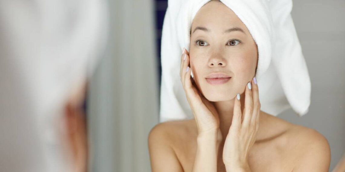 Woman treats herself with retinol cream