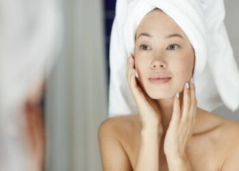 Woman treats herself with retinol cream