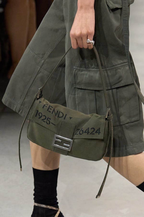 Olive green cargo skirt with baguette bag by Fendi