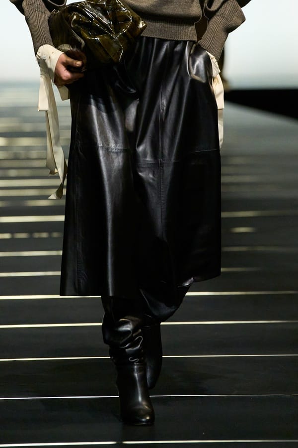 Black leather midi skirt with boots by Ferretti