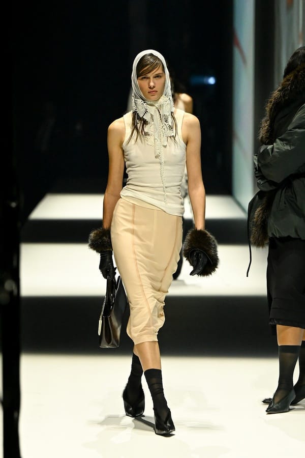 Beige pencil skirt with lace scarf on the runway