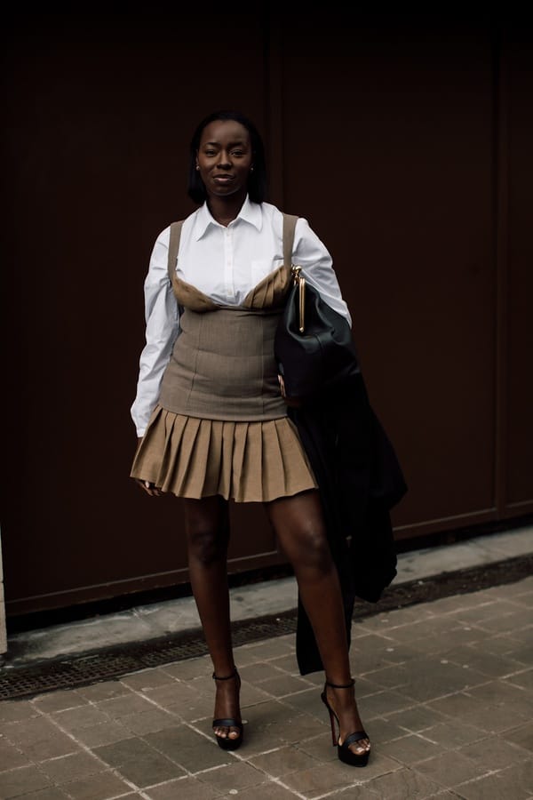 Beige pleated mini skirt with bustier top and white blouse, Streetstyle London