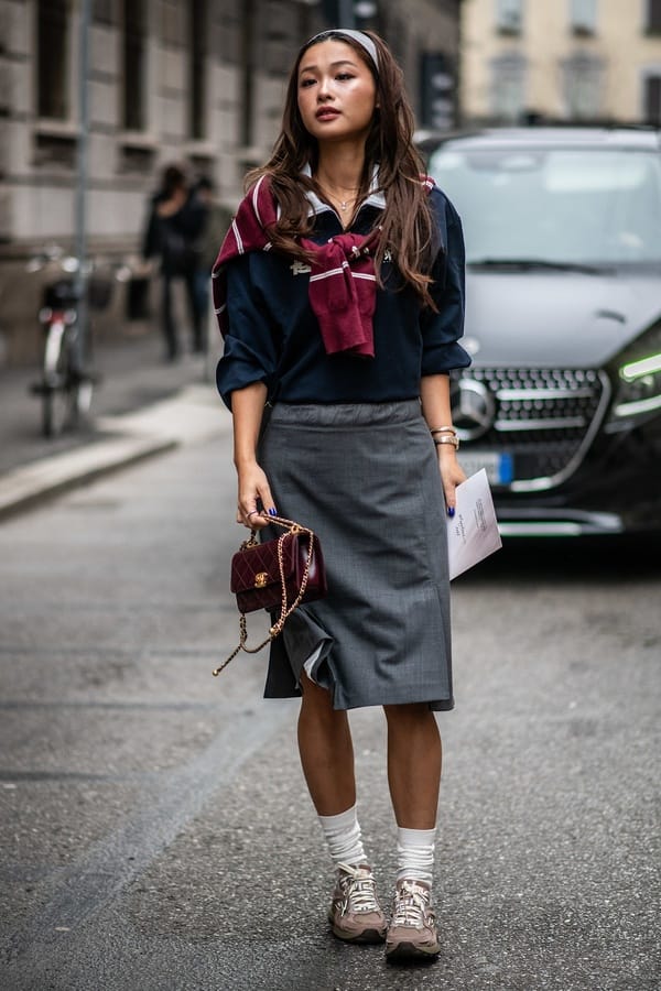 Grey skirt with navy sweater and sneakers, Streetstyle Milan