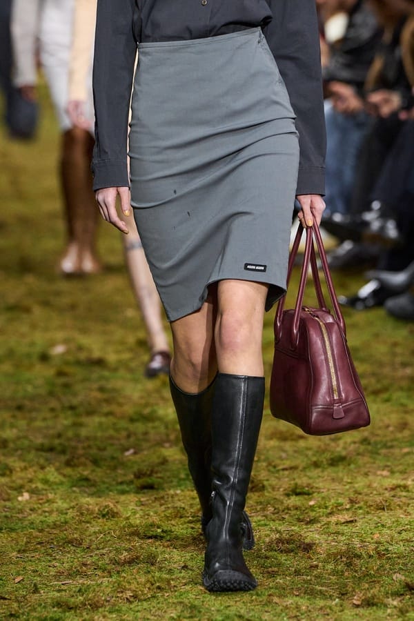 Grey pencil skirt with high boots by Miu Miu