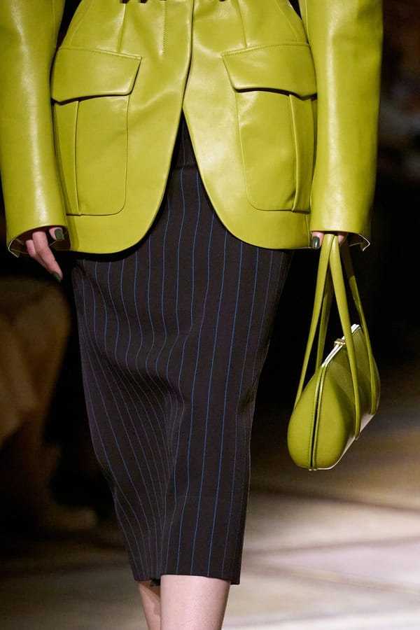 Pinstripe pencil skirt with green leather jacket by Mugler