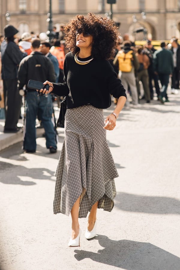 Plaid asymmetrical skirt with black sweater and white pumps, Streetstyle Paris